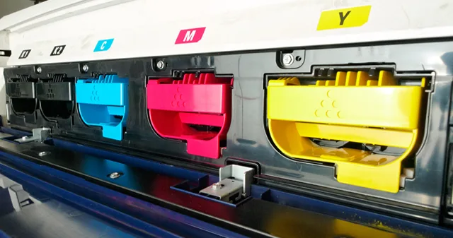 Cyan, magenta and yellow ink cartridges in a wide format printer
