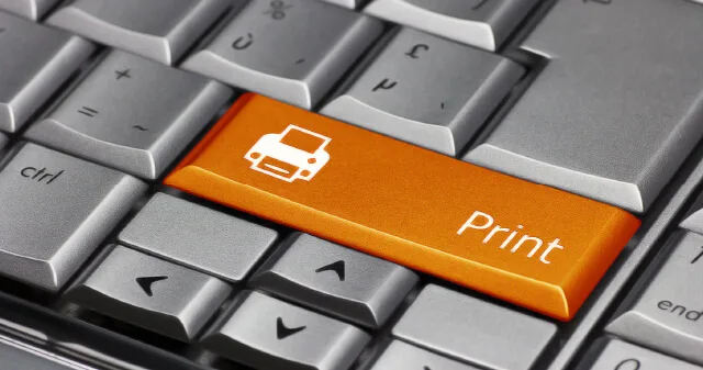 An orange print key on a keyboard